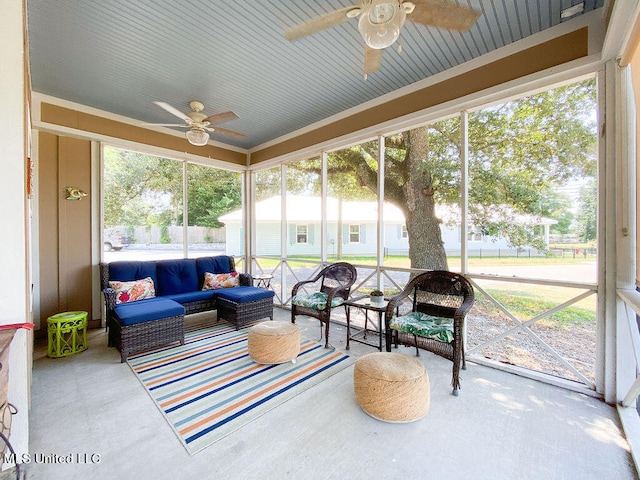 sunroom featuring ceiling fan and a wealth of natural light