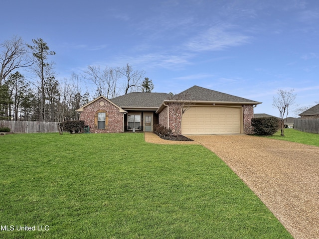 ranch-style home featuring a garage and a front lawn