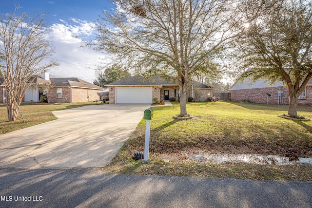 single story home featuring a garage and a front lawn