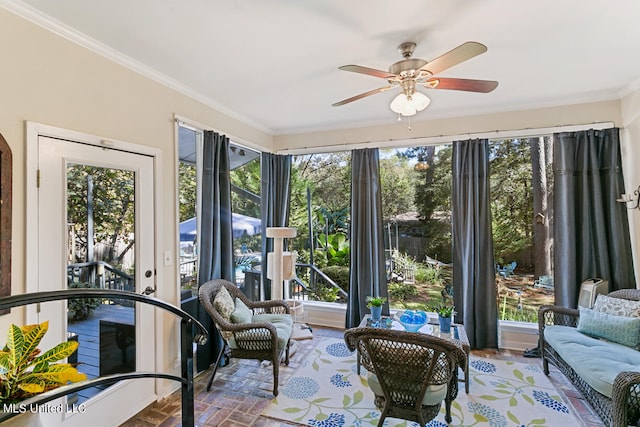 sunroom with ceiling fan and plenty of natural light