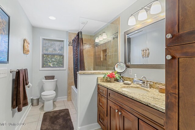 full bathroom featuring toilet, tile patterned flooring, vanity, and shower / tub combo