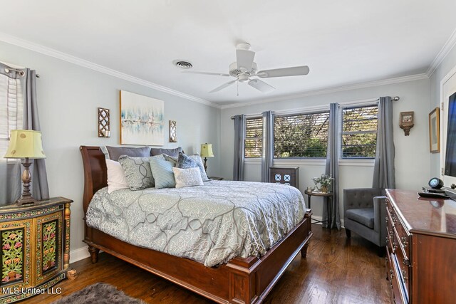 bedroom featuring ceiling fan, ornamental molding, and dark hardwood / wood-style flooring