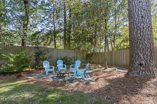 view of yard with an outdoor fire pit