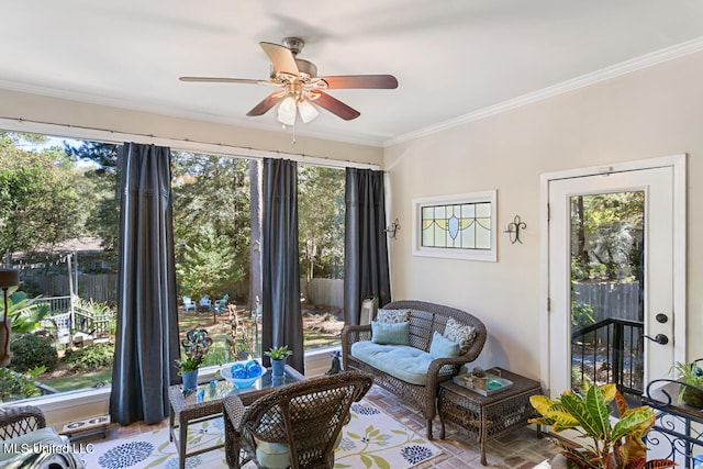 interior space with crown molding and ceiling fan