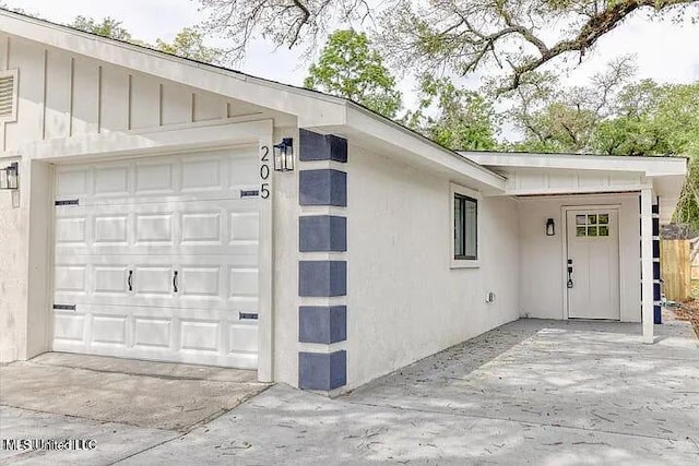 exterior space with concrete driveway