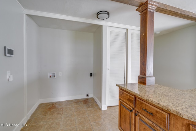 washroom featuring decorative columns, washer hookup, and light tile patterned flooring