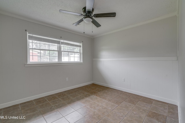 tiled empty room featuring ornamental molding, ceiling fan, and a textured ceiling