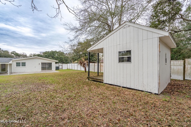 view of outdoor structure with a lawn