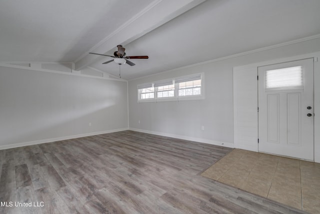 entrance foyer featuring vaulted ceiling with beams, ceiling fan, and light hardwood / wood-style flooring