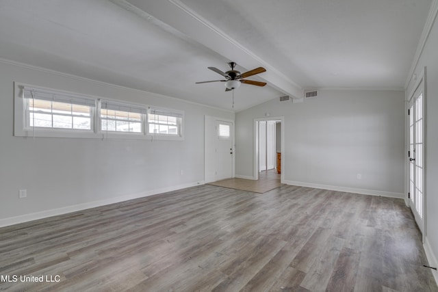 spare room featuring ceiling fan, light hardwood / wood-style flooring, vaulted ceiling with beams, and a wealth of natural light