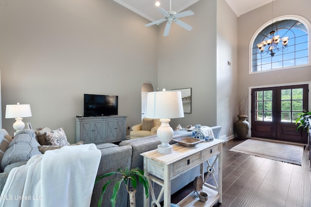 2038 Nottaway Dr, Southaven, MS 38672 - living area featuring ornamental molding, a towering ceiling, arched walkways, baseboards, and a chandelier
