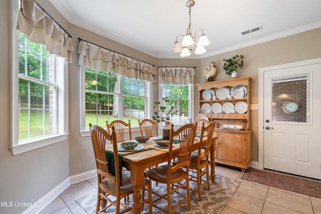2038 Nottaway Dr, Southaven, MS 38672 - dining space featuring light tile patterned floors, a chandelier, ornamental molding, and baseboards