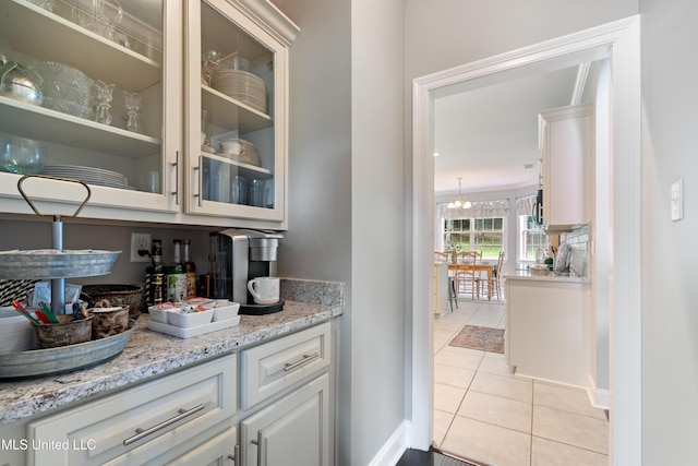 2038 Nottaway Dr, Southaven, MS 38672 - bar featuring light tile patterned flooring and baseboards