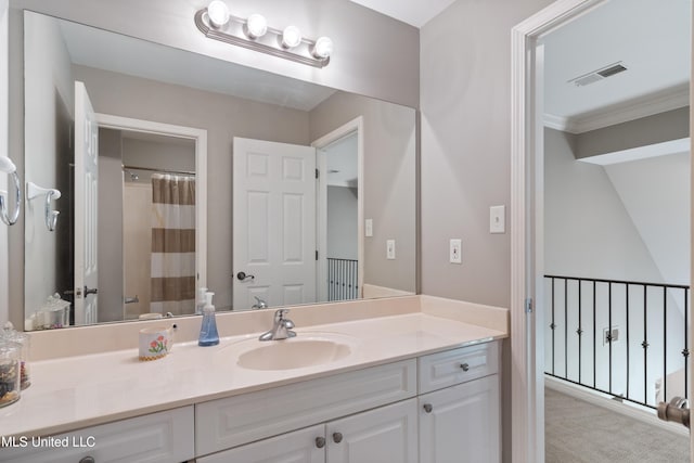 full bath with vanity and crown molding