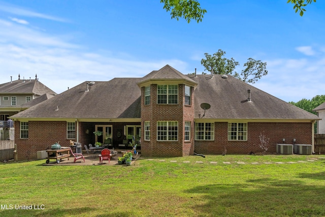 2038 Nottaway Dr, Southaven, MS 38672 - back of house featuring a patio, brick siding, a shingled roof, and central AC unit