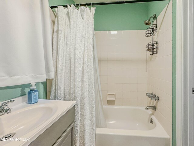 6085 Apache Dr, Kiln, MS 39556 - bathroom featuring vanity and shower / bath combo with shower curtain