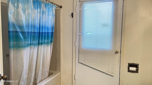 bathroom featuring shower / bath combination with curtain