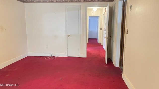 unfurnished room featuring carpet flooring