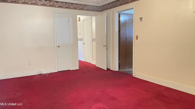 empty room with carpet floors and ornamental molding