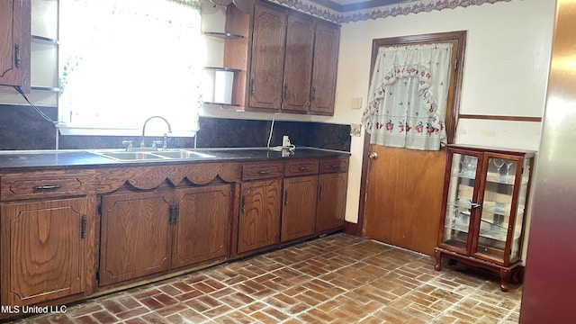 kitchen featuring decorative backsplash and sink