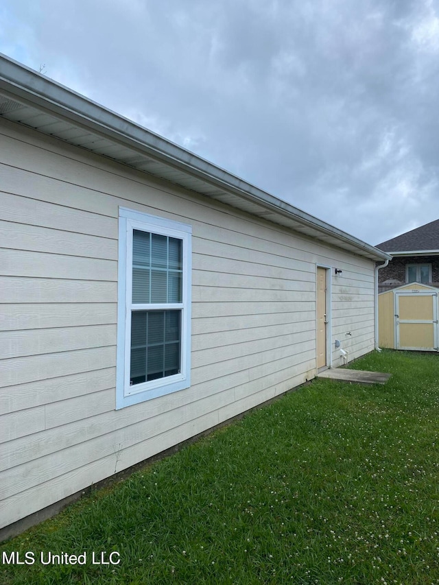 view of property exterior featuring a lawn