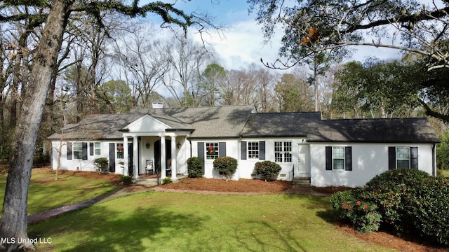 ranch-style home with a front lawn