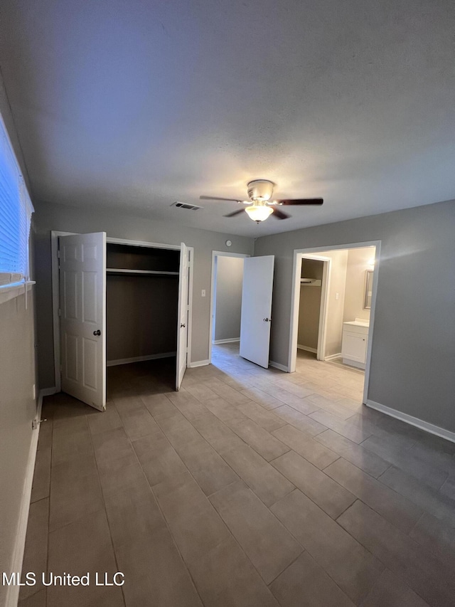 4224 Cypress Dr, Jackson, MS 39212 - unfurnished bedroom featuring a closet, baseboards, and ceiling fan