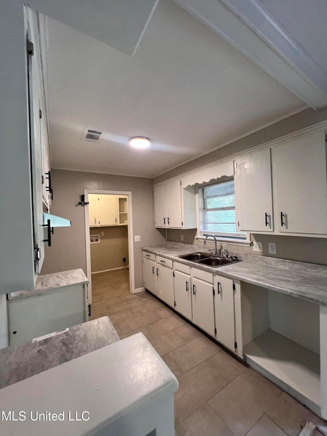 kitchen with white cabinets and sink