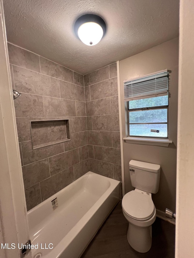 4224 Cypress Dr, Jackson, MS 39212 - bathroom featuring a textured ceiling, toilet, and wood finished floors