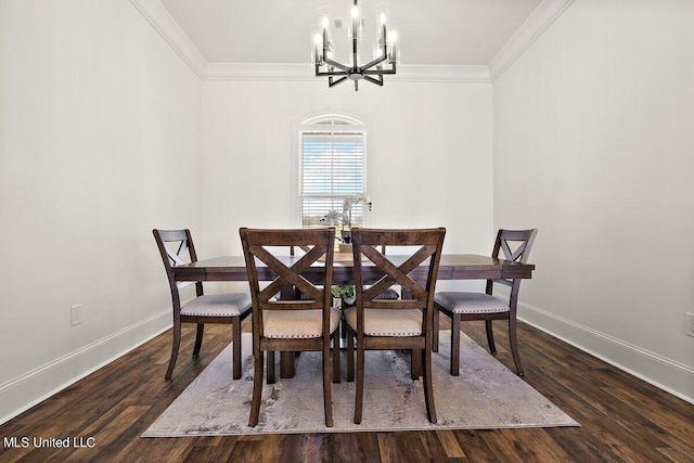 dining area with an inviting chandelier, dark hardwood / wood-style floors, and crown molding