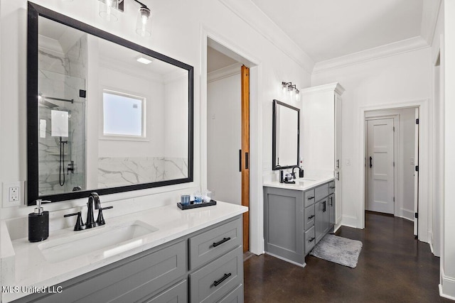 bathroom with vanity, ornamental molding, and a shower with door