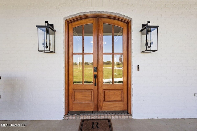 property entrance featuring french doors