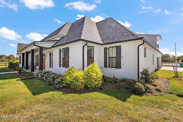 view of property exterior with a yard