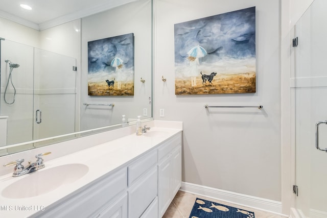 bathroom with vanity, tile patterned flooring, and a shower with door