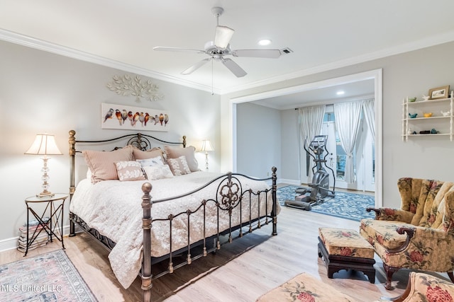 bedroom featuring crown molding, hardwood / wood-style flooring, and ceiling fan