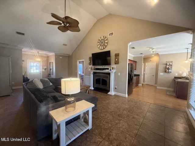 living area with ceiling fan, baseboards, visible vents, and crown molding