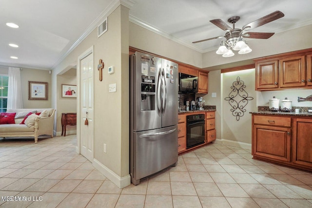 kitchen with light tile patterned floors, brown cabinetry, black appliances, and crown molding