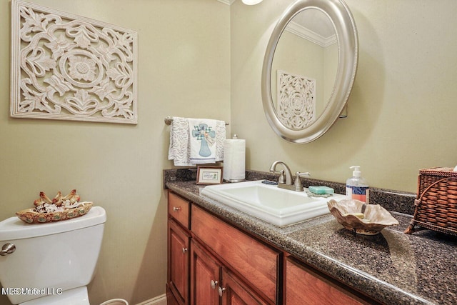 bathroom featuring toilet and vanity