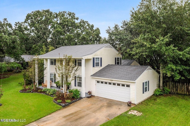 view of front facade featuring driveway, fence, roof with shingles, an attached garage, and a front yard