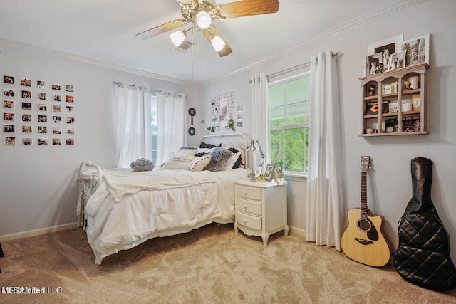 bedroom with ceiling fan, light colored carpet, baseboards, and ornamental molding