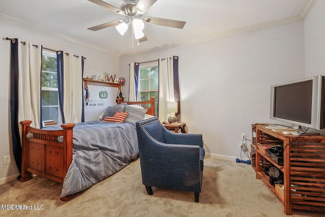 carpeted bedroom with a ceiling fan, crown molding, and baseboards