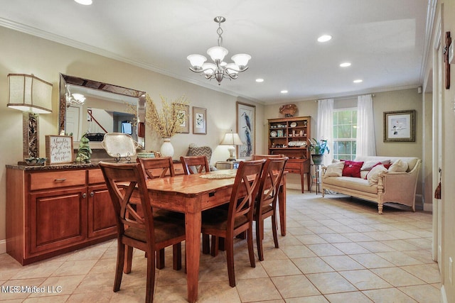 dining area with light tile patterned floors, an inviting chandelier, and crown molding