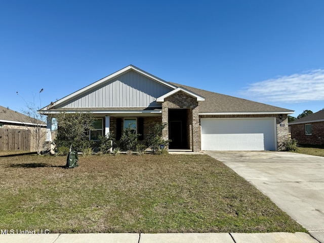 view of front of house featuring a garage and a front yard