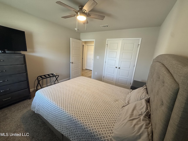 carpeted bedroom with a closet and ceiling fan