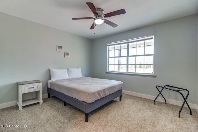 bedroom featuring ceiling fan and light colored carpet