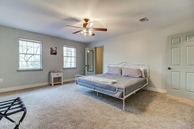 bedroom with ceiling fan and carpet flooring