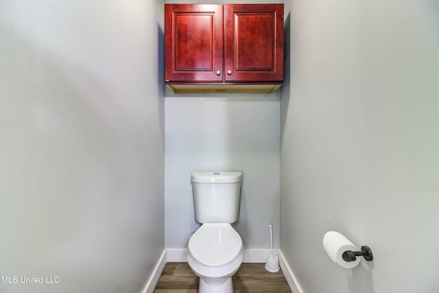 bathroom featuring toilet and hardwood / wood-style floors