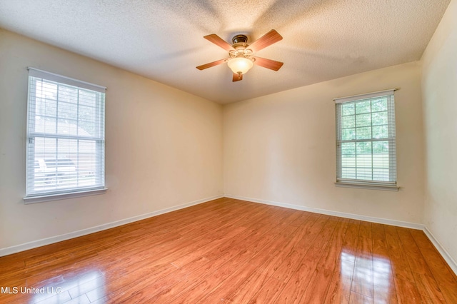 7643 Broken Hickory Dr, Walls, MS 38680 - spare room with light wood finished floors, ceiling fan, a textured ceiling, and baseboards