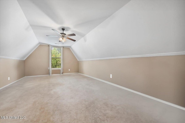 bonus room featuring a ceiling fan, lofted ceiling, baseboards, and carpet flooring