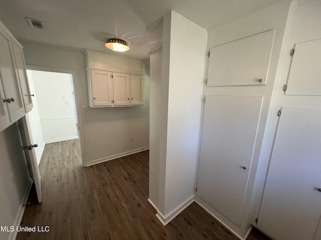 hall featuring dark wood-type flooring